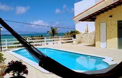 Imagem: A casa possui 3 Dormitórios, 4 Vagas na garagem e está localizado