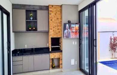 Imagem: A casa possui 3 Dormitórios, 5 Banheiros, 4 Vagas na garagem