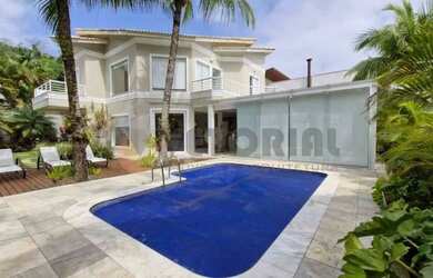 Imagem: A casa possui 4 Dormitórios, 5 Banheiros, 5 Vagas na garagem