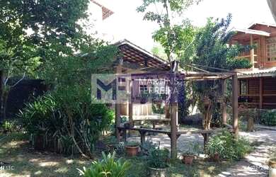 Imagem: A casa possui 3 Dormitórios, 5 Banheiros, 5 Vagas na garagem