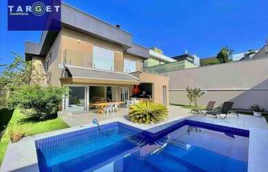 Imagem: A casa em condomínio possui 4 Dormitórios, 5 Banheiros, 5