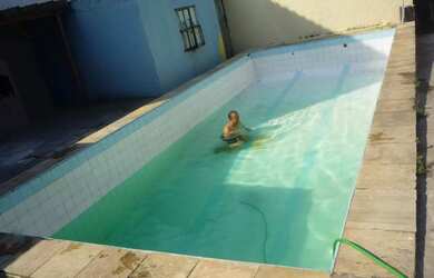 Imagem: A casa possui 4 Dormitórios, 3 Banheiros, 5 Vagas na garagem