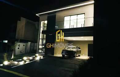 Imagem: A casa possui 3 Dormitórios, 5 Banheiros, 4 Vagas na garagem