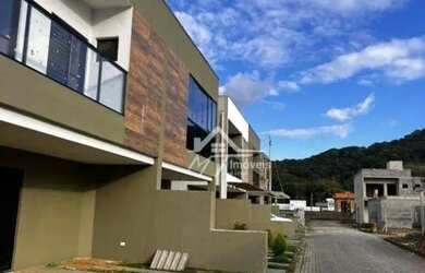 Imagem: A casa em condomínio possui 3 Dormitórios, 4 Banheiros, 2