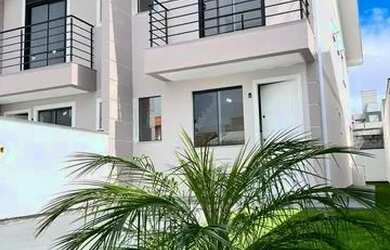 Imagem: A casa possui 3 Dormitórios, 3 Banheiros, 2 Vagas na garagem