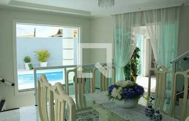 Imagem: A casa possui 4 Dormitórios, 5 Banheiros, 5 Vagas na garagem