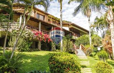 Imagem: A casa possui 5 Dormitórios, 5 Banheiros, 5 Vagas na garagem