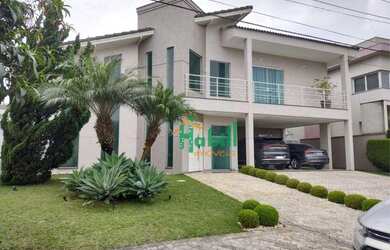 Imagem: A casa em condomínio possui 5 Dormitórios, 5 Banheiros, 4