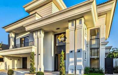 Imagem: A casa em condomínio possui 5 Dormitórios, 5 Banheiros e 420m²