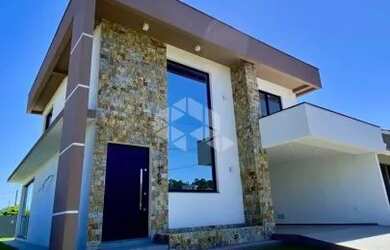 Imagem: A casa em condomínio possui 3 Dormitórios, 3 Banheiros, 2