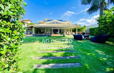 Imagem: A casa possui 5 Dormitórios, 5 Banheiros, 4 Vagas na garagem