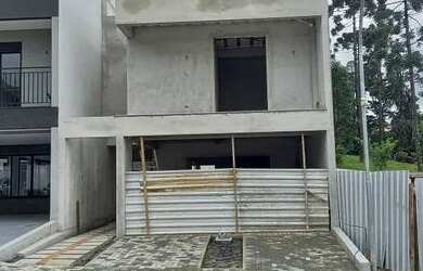 Imagem: A casa possui 3 Dormitórios, 4 Banheiros, 4 Vagas na garagem