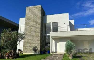 Imagem: A casa em condomínio possui 4 Dormitórios, 5 Banheiros, 2