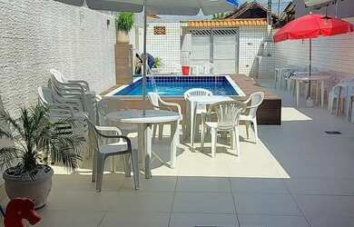 Imagem: A casa possui 2 Dormitórios e 1 Vaga na garagem e está localizado