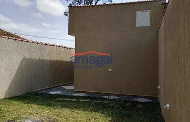 Imagem: A casa possui 2 Dormitórios, 1 Banheiro, 2 Vagas na garagem