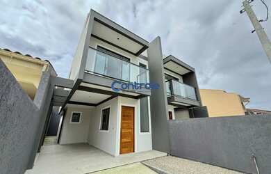 Imagem: A casa possui 2 Dormitórios, 3 Banheiros, 2 Vagas na garagem