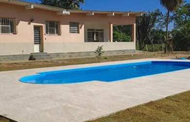 Imagem: A casa possui 4 Dormitórios e está localizado em Granja Das