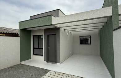 Imagem: A casa possui 3 Dormitórios, 3 Banheiros, 2 Vagas na garagem