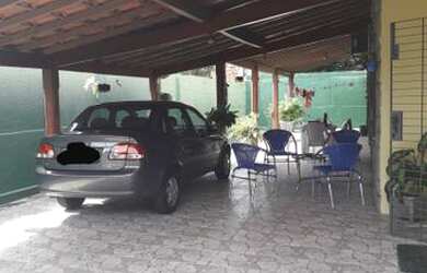 Imagem: A casa possui 4 Dormitórios, 4 Vagas na garagem e está localizado