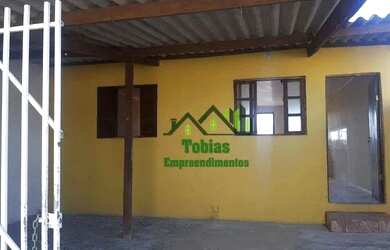 Imagem: A casa possui 2 Dormitórios, 1 Banheiro, 2 Vagas na garagem