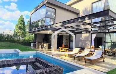 Imagem: A casa em condomínio possui 4 Dormitórios, 5 Banheiros, 4