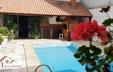 Imagem: A casa possui 4 Dormitórios e está localizado em Jaraguá