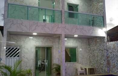 Imagem: A casa possui 3 Dormitórios, 2 Vagas na garagem e está localizado