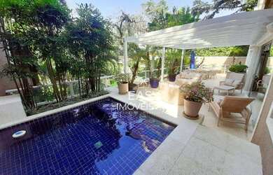 Imagem: A casa possui 3 Dormitórios, 5 Banheiros, 2 Vagas na garagem