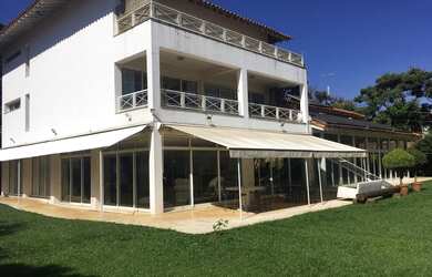 Imagem: A casa possui 4 Dormitórios, 5 Banheiros, 5 Vagas na garagem