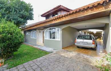 Imagem: A casa possui 4 Dormitórios, 3 Banheiros, 5 Vagas na garagem