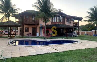 Imagem: A casa possui 5 Dormitórios, 5 Banheiros, 5 Vagas na garagem