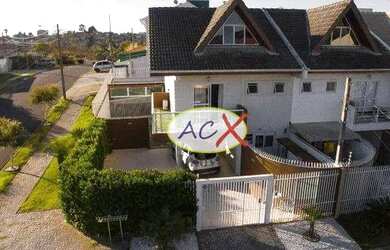 Imagem: A casa possui 3 Dormitórios, 3 Banheiros, 4 Vagas na garagem