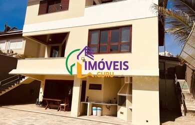 Imagem: A casa em condomínio possui 4 Dormitórios, 4 Banheiros e 450m²