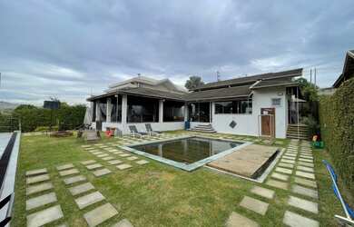 Imagem: A casa em condomínio possui 5 Dormitórios, 5 Banheiros, 5