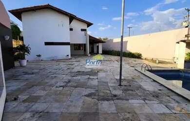 Imagem: A casa possui 5 Dormitórios, 5 Banheiros, 5 Vagas na garagem