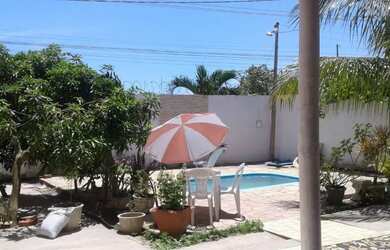 Imagem: A casa possui 3 Dormitórios, 5 Banheiros, 3 Vagas na garagem