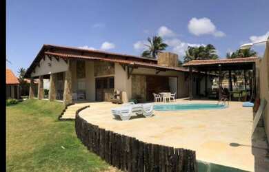 Imagem: A casa possui 5 Dormitórios, 5 Banheiros, 5 Vagas na garagem