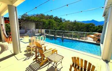 Imagem: A casa possui 4 Dormitórios, 5 Banheiros, 5 Vagas na garagem