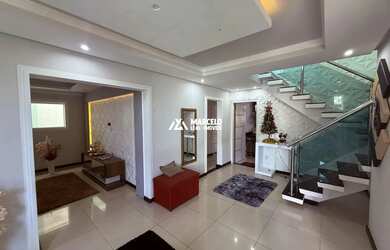 Imagem 6: Vendo casa de 5/4 sendo 02 suítes com 03 salas e 03 vagas de uso mixto...