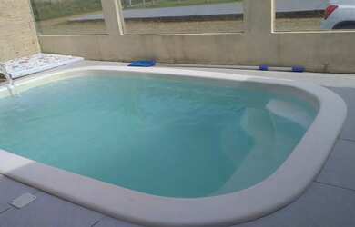 Imagem: A casa possui 5 Dormitórios, 2 Banheiros, 4 Vagas na garagem