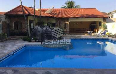 Imagem: A casa possui 4 Dormitórios, 4 Banheiros, 4 Vagas na garagem