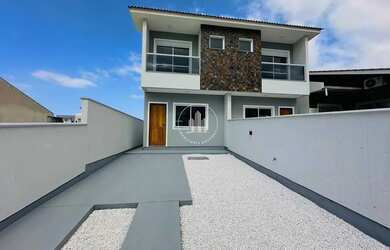 Imagem: A casa possui 2 Dormitórios, 3 Banheiros, 1 Vaga na garagem