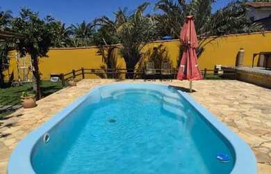 Imagem: A casa possui 3 Dormitórios, 3 Banheiros, 3 Vagas na garagem