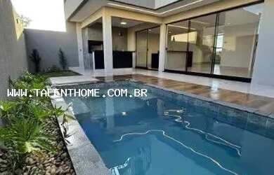 Imagem: A casa possui 3 Dormitórios, 3 Banheiros, 2 Vagas na garagem