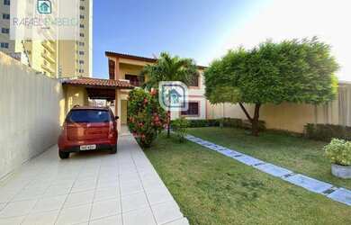 Imagem: A casa possui 4 Dormitórios, 4 Banheiros, 5 Vagas na garagem