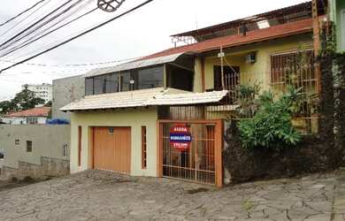 Imagem: A casa possui 3 Dormitórios, 1 Banheiro, 5 Vagas na garagem