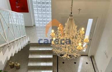 Imagem: A casa possui 4 Dormitórios, 5 Banheiros, 3 Vagas na garagem