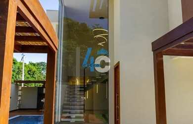 Imagem: A casa possui 4 Dormitórios, 4 Banheiros, 2 Vagas na garagem