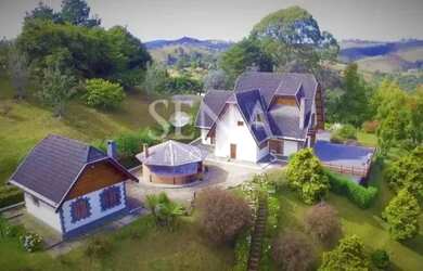 Imagem: A casa possui 5 Dormitórios, 5 Banheiros, 5 Vagas na garagem