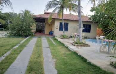 Imagem: A casa possui 4 Dormitórios, 4 Vagas na garagem e está localizado